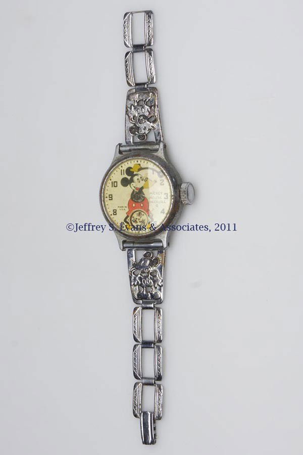 INGERSOLL MICKEY MOUSE WRIST WATCH: INGERSOLL MICKEY MOUSE WRIST WATCH, arms as dial hands, original bracelet-style band. First half 20th century. 6" LOA. Provenance: Estate of Harry L. Jackson, Bowling Green, KY.