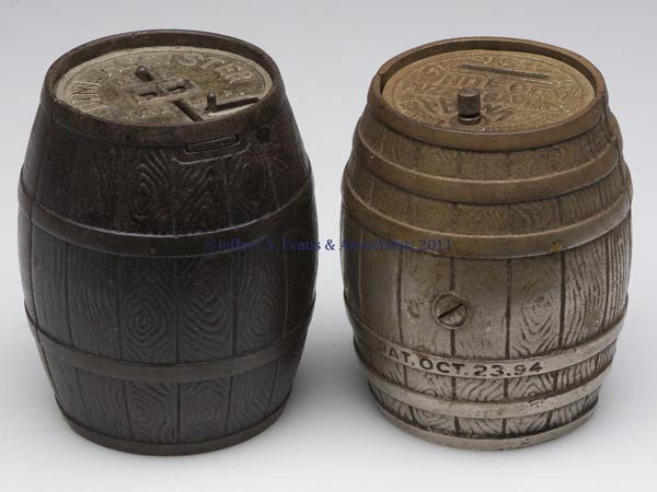 TWO BARREL-FORM CAST-IRON STILL BANKS: TWO BARREL-FORM CAST-IRON STILL BANKS, comprising a "No. 1 / WHITE CITY / PUZZLE SAVINGS / BANK / A BARREL OF MONEY" with patent date and Nicol & Co. on sides, and "DIME REGISTER / 10c / PAT Apd." wit