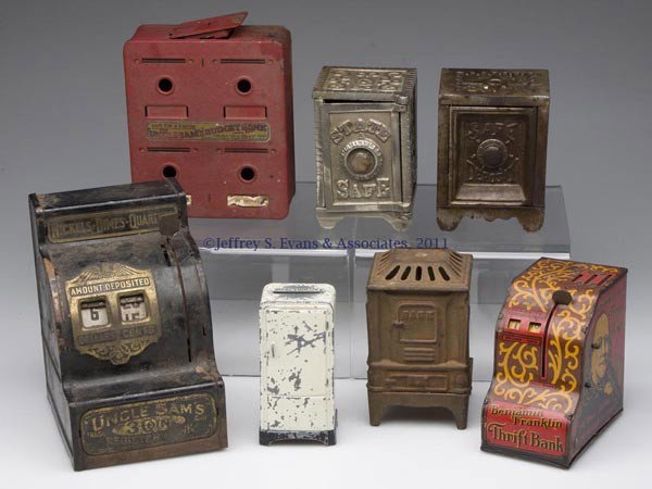 SEVEN ASSORTED CAST-IRON AND TIN STILL BANKS: SEVEN ASSORTED CAST-IRON AND TIN STILL BANKS, including "STATE SAFE" and "SAFE DEPOSIT" examples. Late 19th to first half 20th century. 4" to 6" H. Provenance: Property of a Winchester, VA collector.