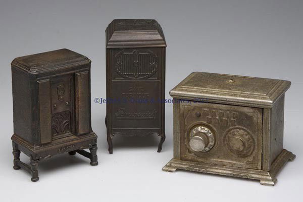 THREE ASSORTED FIGURAL STILL BANKS: THREE ASSORTED FIGURAL STILL BANKS, comprising a cast-iron "RADIO BANK", a cast-iron Majestic radio, and a copper/brass Brunswick upright phonograph, each with original surface. First half 20th centur