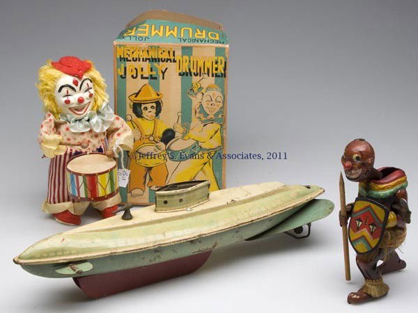 THREE ASSORTED WIND-UP TIN TOYS: THREE ASSORTED WIND-UP TIN TOYS, comprising a Native, drummer with box, and a boat Lacking key. 20th century. 6 1/2" H tallest. Provenance: From the collection of Pat and the late Bob Costa.