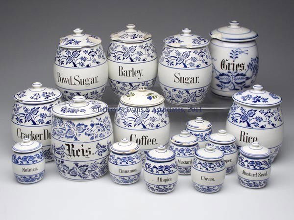 GERMAN CERAMIC KITCHEN CANISTERS, LOT OF 16: GERMAN CERAMIC KITCHEN CANISTERS, LOT OF 16, each with a Blue Onion type pattern and contents designation, most marked Germany. Late 19th/early 20th century. 3 3/4" to 6 1/2" HOA. Provenance: From a