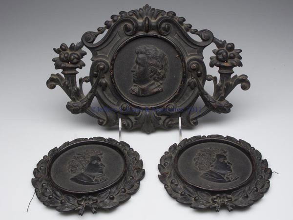 THREE MOLDED GUTTA-PERCHA PLAQUES: THREE MOLDED GUTTA-PERCHA PLAQUES, each depicting a bust of a composer and with small mounting holes at sides. Second half 19th century. 6 1/2" D and 8" x 12 1/2". Provenance: From the collection of P