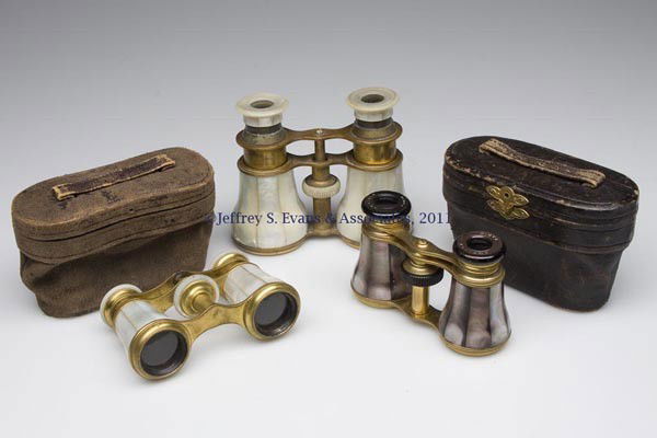 THREE PAIR OF OPERA GLASSES: THREE PAIR OF OPERA GLASSES, mother-of-pearl and gilt brass, two examples with leather cases are marked Paris and "ARVILLE" and "MARCHAND". Late 19th/early 20th century. 3 3/4" to 4 1/4" W. Provenanc