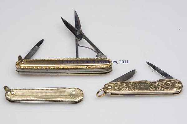 THREE GOLD-HANDLE PEN KNIVES: THREE GOLD-HANDLE PEN KNIVES, one with scissors and file, one marked 10K, others unmarked and of unknown gold content, blades marked for England and Germany. Late 19th/early 20th century. 2 3/8" to 3"