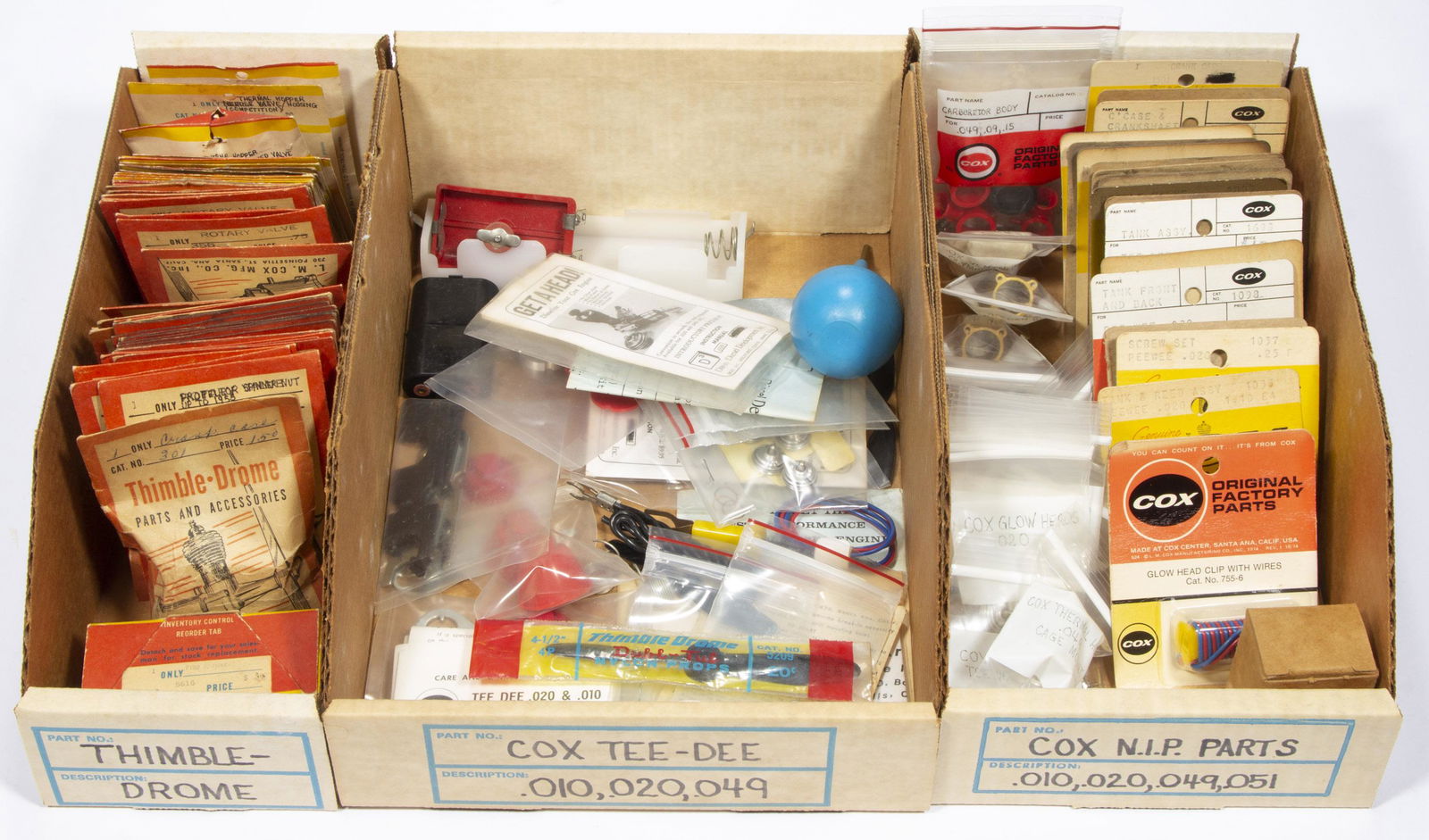 L. M. COX MANUFACTURING CO. MODEL AIRPLANE ENGINE PARTS AND RELATED ARTICLES, UNCOUNTED LOT, (1 of 3)