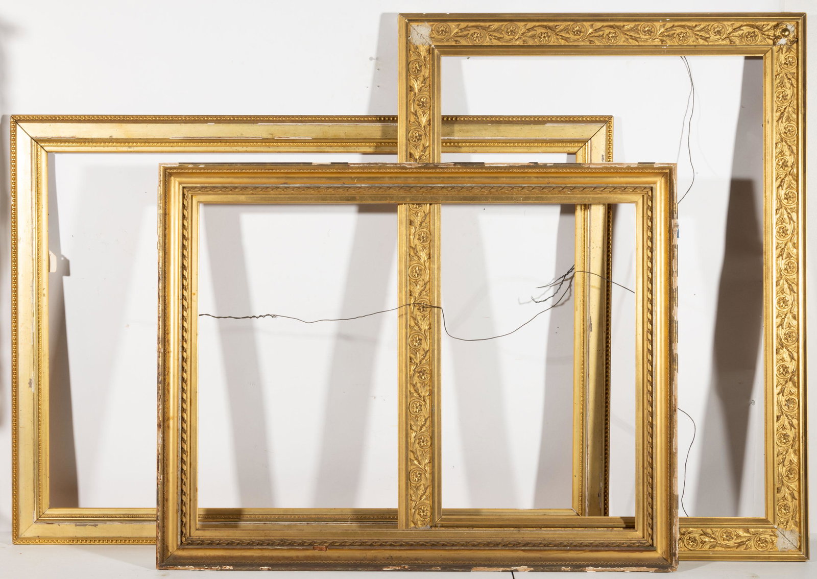 ANTIQUE MOLDED-GILT AND GESSO PICTURE FRAMES, LOT OF THREE,: ANTIQUE MOLDED-GILT AND GESSO PICTURE FRAMES, LOT OF THREE, each retains original gilded surface. 19th century. 48" x 34" OA.Provenance: Property deaccessioned by the Mount Vernon Ladies' Association,