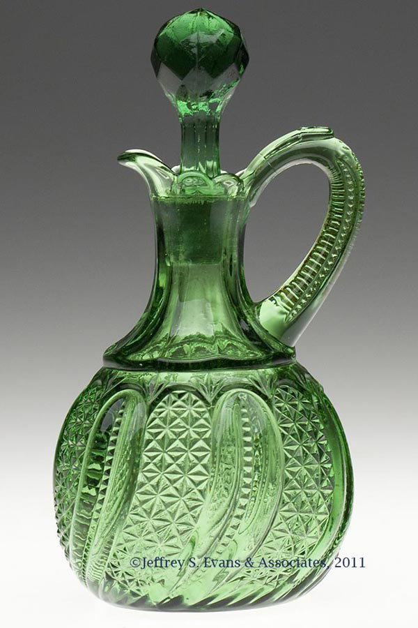 FEATHER CRUET: FEATHER CRUET, green, original facetted stopper. Late 19th/early 20th century. 6 1/2" HOA, 5" H lip. Provenance: Personal collection of Judith (Judy) Cronin, Orleans, MA.