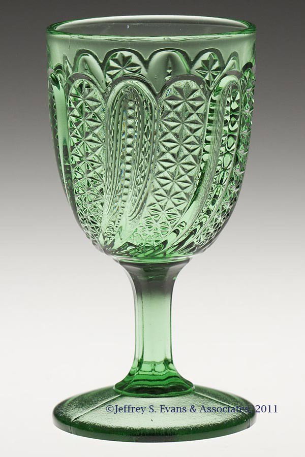 FEATHER WINE GLASS: FEATHER WINE GLASS, green. Late 19th/early 20th century. 3 7/8" H. Provenance: Personal collection of Judith (Judy) Cronin, Orleans, MA.