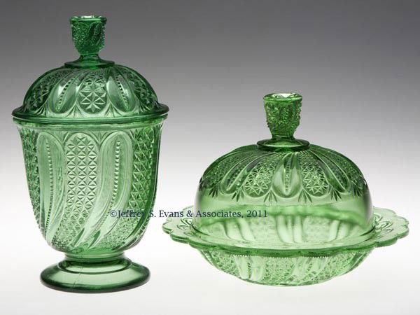 FEATHER TABLE ARTICLES, LOT OF TWO: FEATHER TABLE ARTICLES, LOT OF TWO, green, comprising a butter dish and covered sugar. Late 19th/early 20th century. 4 1/2" to 7 1/2" HOA. Provenance: Personal collection of Judith (Judy) Cronin, Orle