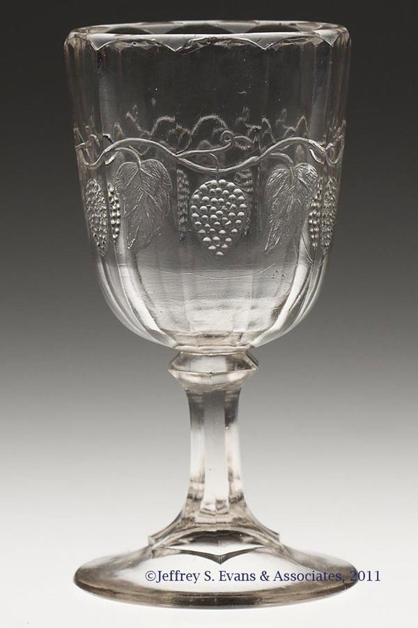 BRADFORD GRAPE CHAMPAGNE GLASS: BRADFORD GRAPE CHAMPAGNE GLASS, colorless lead glass. Third quarter 19th century. 5 1/4" H.