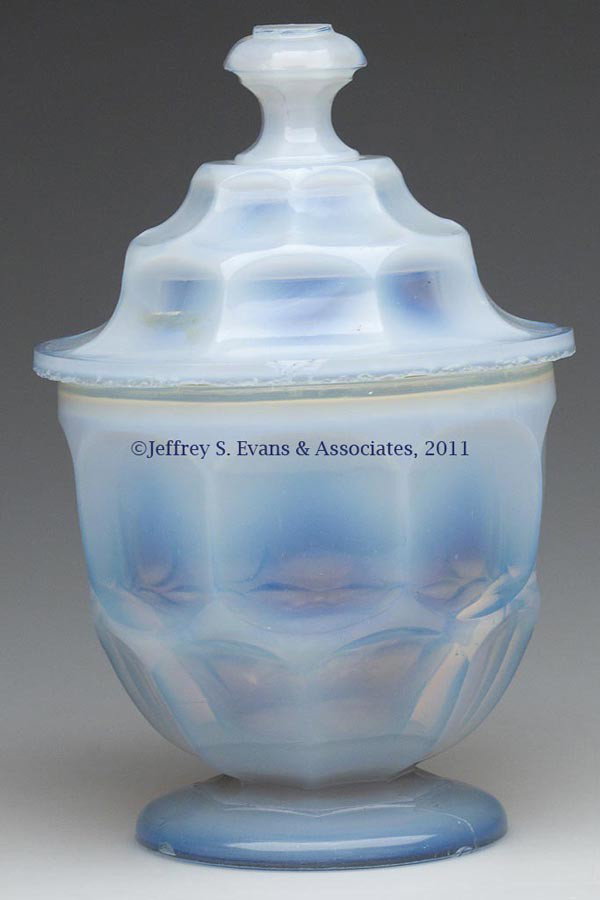 ASHBURTON SUGAR BOWL WITH COVER: ASHBURTON SUGAR BOWL WITH COVER, strong fiery opalescent, raised on a circular foot with rough pontil mark, cover with tall octagonal finial with wide flat top and rounded edges. Probably Pittsburgh a