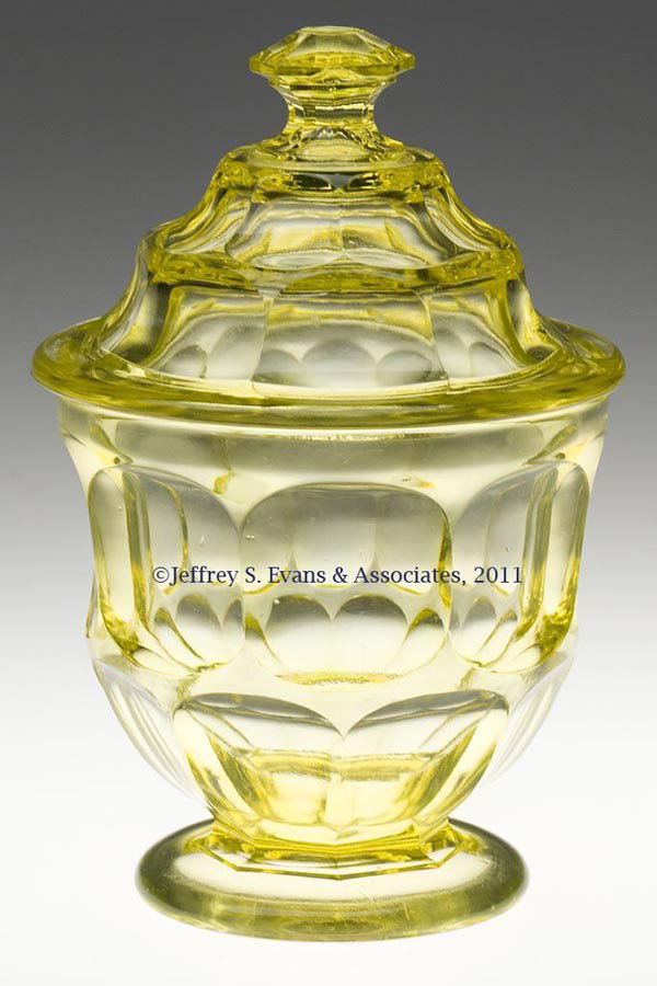 ASHBURTON SUGAR BOWL WITH COVER: ASHBURTON SUGAR BOWL WITH COVER, canary yellow, raised on a circular foot with polished pontil mark, cover with traditional octagonal finial. Boston & Sandwich Glass Co., New England Glass Co., and pr