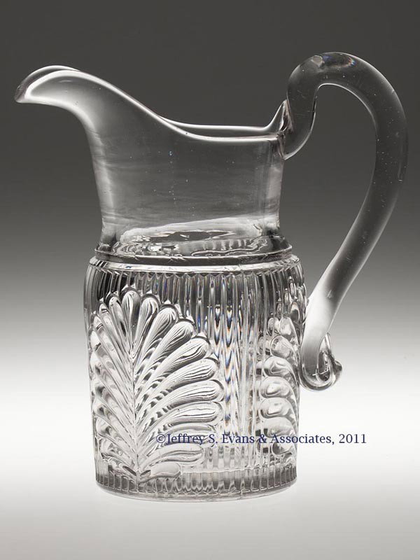 RIBBED PALM QUART JUG / WATER PITCHER: RIBBED PALM QUART JUG / WATER PITCHER, colorless lead glass, applied solid handle, plain base with polished pontil mark. Boston & Sandwich Glass Co. and possibly others. Third quarter 19th century. 9"