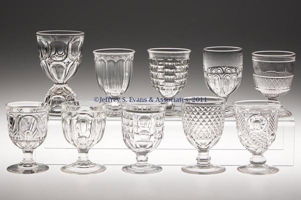 VARIOUS EAPG EGG CUPS, LOT OF TEN: VARIOUS EAPG EGG CUPS, LOT OF TEN, colorless lead glass, including a double Excelsior example, and single Washington and Horn of Plenty. Third quarter 19th century. 3 1/2" to 4 5/8" H.