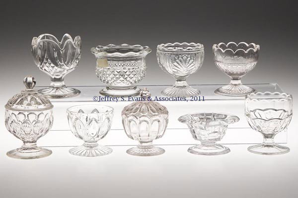 VARIOUS EAPG SALTS, LOT OF NINE: VARIOUS EAPG SALTS, LOT OF NINE, colorless lead and non-lead glass, two with covers. Second half 19th century. Various sizes. Provenance: Personal collection of Judith (Judy) Cronin, Orleans, MA.
