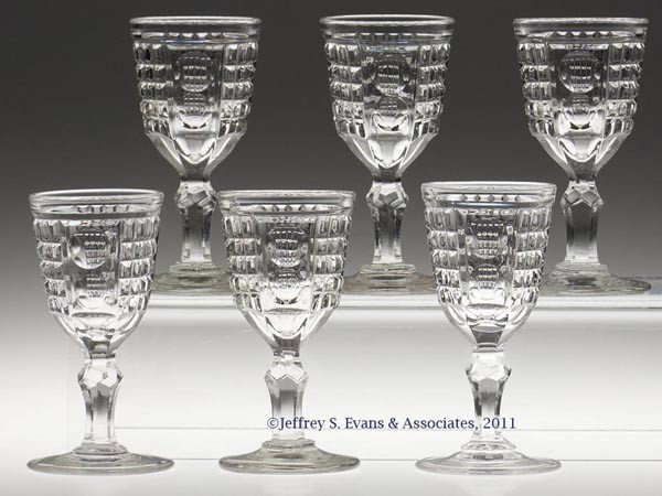 WAFFLE AND THUMBPRINT / PALACE (OMN) SET OF SIX WI: WAFFLE AND THUMBPRINT / PALACE (OMN) SET OF SIX WINES, colorless lead glass, each with six petals at base stem and a polished pontil mark. New England and Pittsburgh areas including New England Glass 