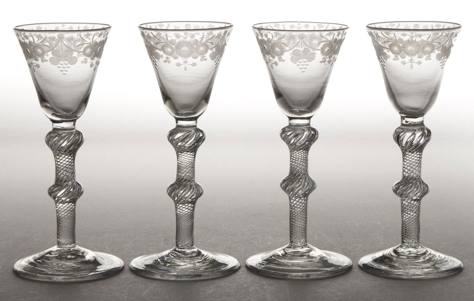 ENGLISH FREE-BLOWN AND ENGRAVED AIR-TWIST BALUSTROID SET OF FOUR WINES (1 of 1)