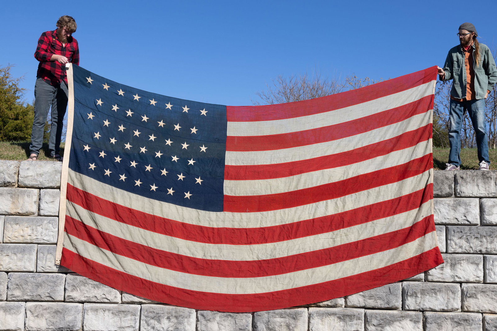 45-STAR UTAH STATEHOOD AMERICAN NATIONAL FLAG: 45-STAR UTAH STATEHOOD AMERICAN NATIONAL FLAG, machine-sewn wool with cotton linen stars, no manufacturer's marks located, canvas hoist with weighted ends. Unframed. Circa 1900. Approximately 94" x 17
