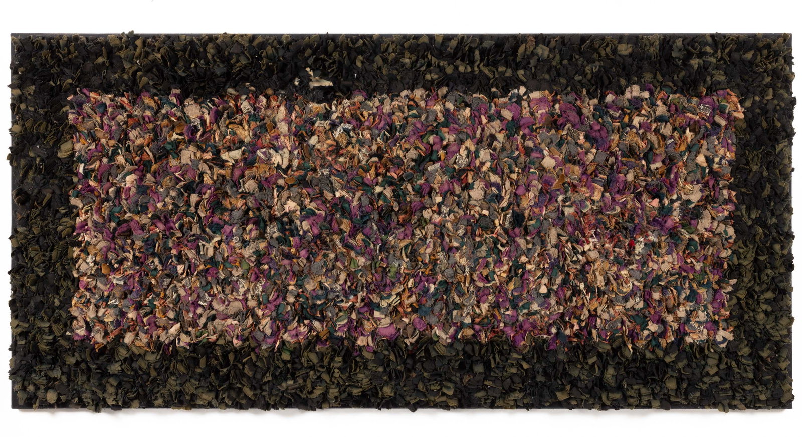 AMERICAN SHAKER RAG RUG: AMERICAN SHAKER RAG RUG, elongated rectangular form, featuring a polychrome field in various fabrics with a dark border around edges, pieces of fabric sewn to fabric and backed by burlap. Mounted to f