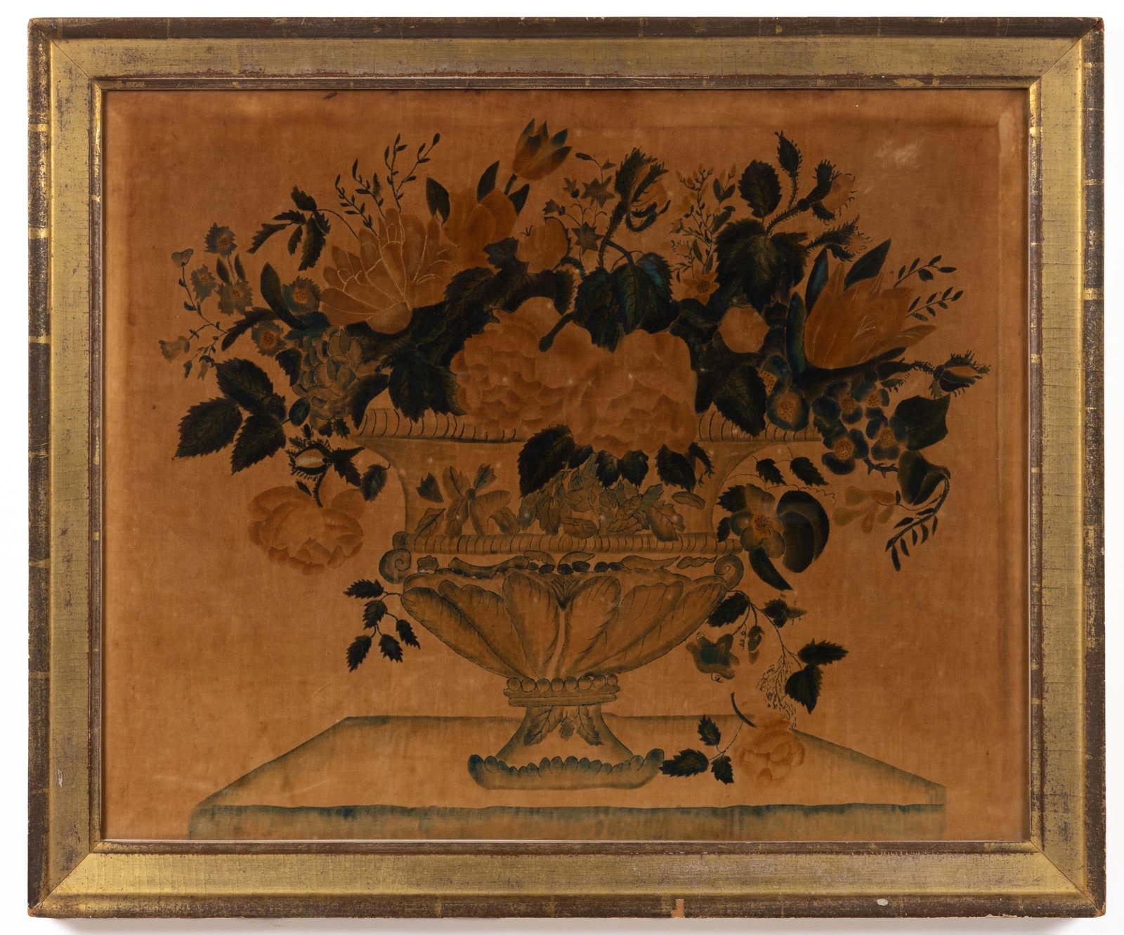 AMERICAN SCHOOL (19TH CENTURY) FOLK ART THEOREM: AMERICAN SCHOOL (19TH CENTURY) FOLK ART THEOREM, watercolor on velvet, still-life depiction of a flowering urn situated on a table, no signature located. Housed under glass in a period gilt frame. Cir