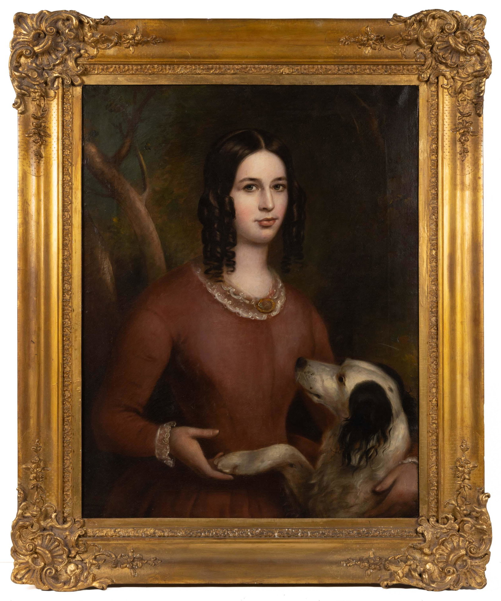 AMERICAN SCHOOL (19TH CENTURY) FOLK ART PORTRAIT OF A GIRL WITH DOG: AMERICAN SCHOOL (19TH CENTURY) FOLK ART PORTRAIT OF A GIRL WITH DOG, oil on canvas, waist-length depiction of figure in high-waisted coral dress, her dark hair adorned with ringlets, her right hand ho