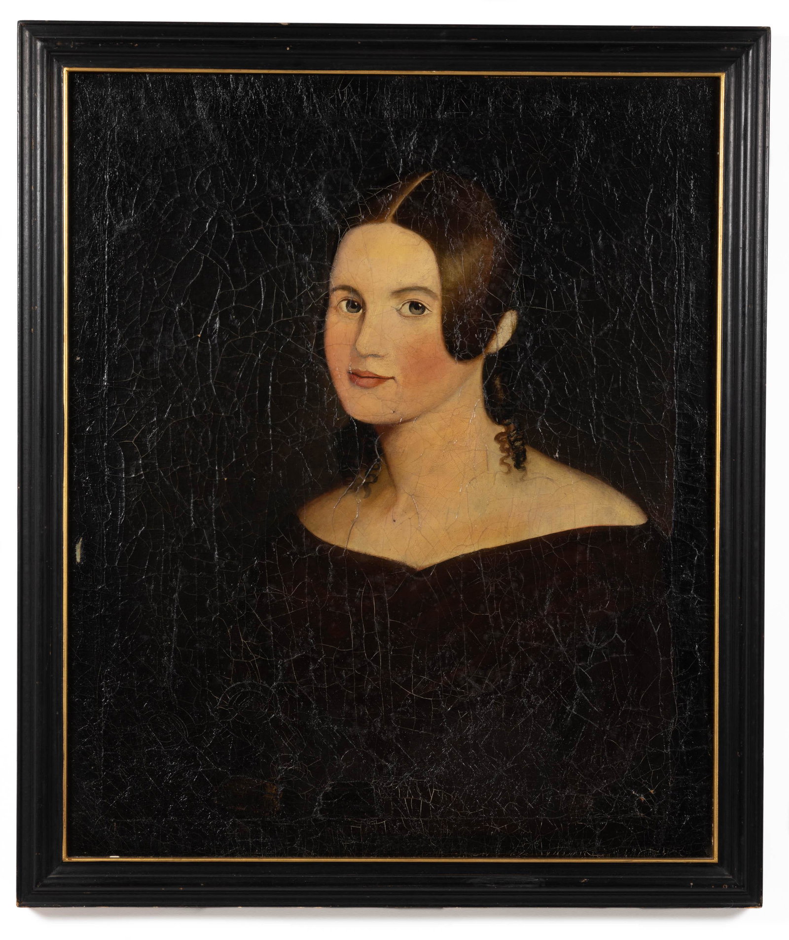 AMERICAN SCHOOL (19TH CENTURY) FOLK ART PORTRAIT OF A YOUNG WOMAN: AMERICAN SCHOOL (19TH CENTURY) FOLK ART PORTRAIT OF A YOUNG WOMAN, oil on canvas, bust-length depiction of a woman with greyish eyes and brown hair curling at the ends, wearing a dark bodice with a ne