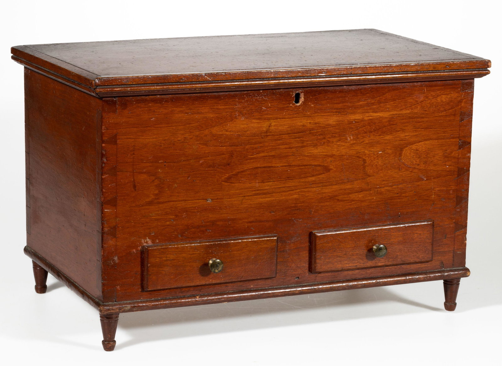 PENNSYLVANIA WALNUT MINIATURE BLANKET CHEST: PENNSYLVANIA WALNUT MINIATURE BLANKET CHEST, hinged rectangular with applied moldings, over dovetailed case, interior with lidded till, above two short drawers with period brass knobs, the whole raise