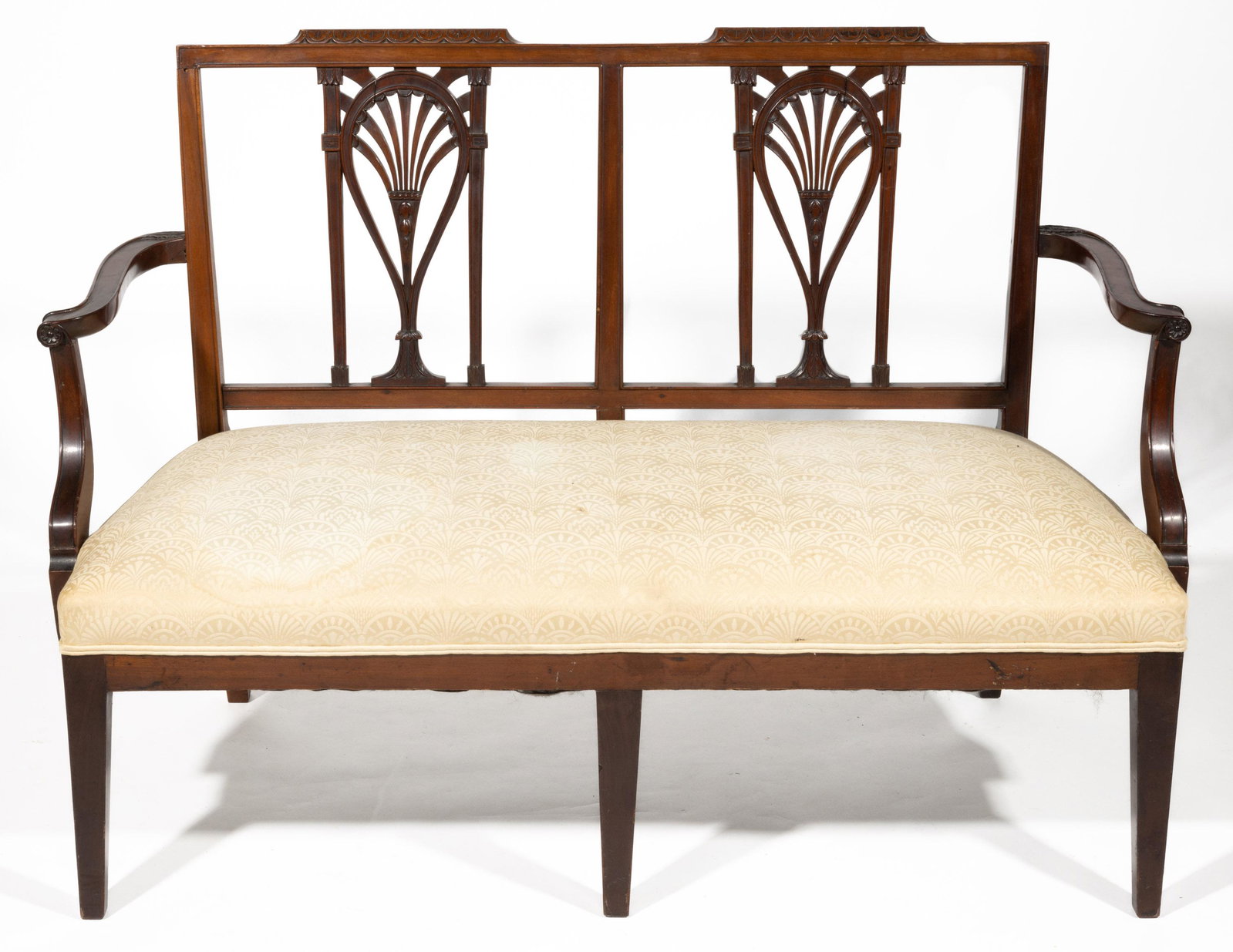 AMERICAN FEDERAL CARVED MAHOGANY RACKET-BACK SETTEE: AMERICAN FEDERAL CARVED MAHOGANY RACKET-BACK SETTEE, featuring carved crestrail and shaped arms. Retains an old surface with warm color. Probably Baltimore, Maryland or Philadelphia, Pennsylvania. Cir