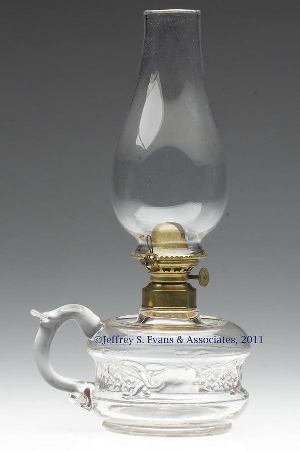 DILLAWAY PATENT LILLY-OF-THE-VALLEY FINGER LAMP: DILLAWAY PATENT LILLY-OF-THE-VALLEY FINGER LAMP, colorless, applied handle with thumbrest, recessed drip-catcher shoulder with exterior embossed "PAT'D. JULY. 18 1871.", No. 1 single base rib collar. 