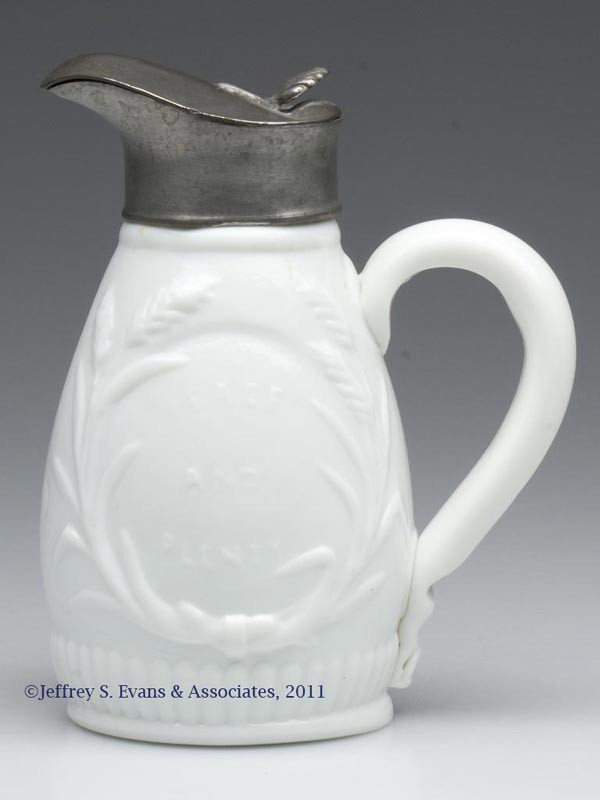 BLOWN-MOLDED "PEACE AND PLENTY" MOLASSES CAN / JUG: BLOWN-MOLDED "PEACE AND PLENTY" MOLASSES CAN / JUG, opaque white/milk glass, small ovoid body featuring lettering within a wheat wreath on one side and a steam-sail vessel within an oval reserve on th