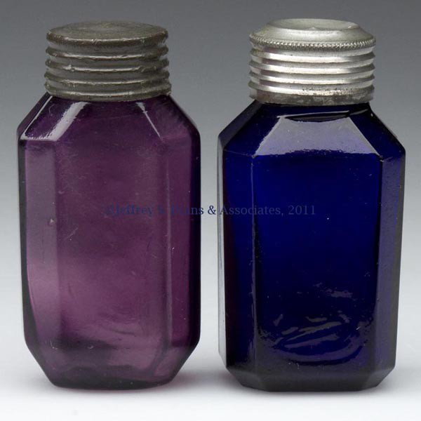 TWO BLOWN-MOLDED COMMERCIAL PUNGENTS: TWO BLOWN-MOLDED COMMERCIAL PUNGENTS, deep cobalt blue and amethyst, slightly differing eight-sided forms, each with appropriate screw cap, blue example with inner cork in cap intact. Boston & Sandwic