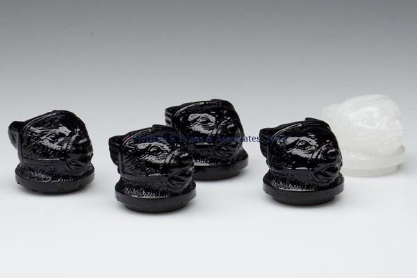 PRESSED MUZZLED BEAR SMALL-SIZE COVERS, LOT OF FIV: PRESSED MUZZLED BEAR SMALL-SIZE COVERS, LOT OF FIVE, clambroth, deep amethyst and opaque black. Boston & Sandwich Glass Co. Third quarter 19th century. 1 1/4" D inner flange. Literature: Parallels B &