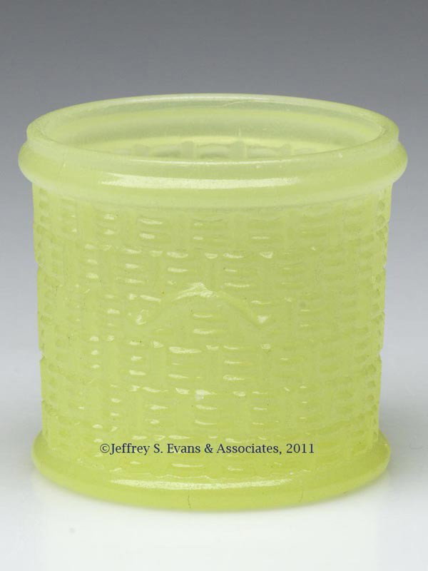 PRESSED BASKET TOOTHPICK HOLDER: PRESSED BASKET TOOTHPICK HOLDER, translucent yellow-green, molded handles on sides, lacking cover. Boston & Sandwich Glass Co. 1850-1870. 2" H, 2" D rim. Literature: Parallels B & K III, fig. 3280b. P