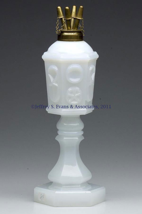 PRESSED STAR AND PUNTY FLUID STAND LAMP: PRESSED STAR AND PUNTY FLUID STAND LAMP, unusual swirling alabaster/clambroth, hexagonal font with a knop extension, raised on a hexagonal baluster-stem base, wafer construction. Period brass fine-lin