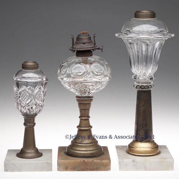 419 THREE ASSORTED FLUID / KEROSENE STAND LAMPS