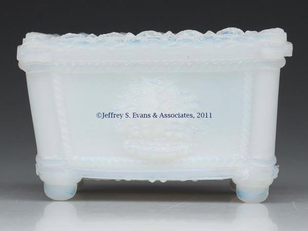 NE-1 NEW ENGLAND MARKED PRESSED SALT: NE-1 NEW ENGLAND MARKED PRESSED SALT, deep fiery opalescent, embossed under base, scallop and point rim. Rare. New England Glass Co. 1835-1850. 1 7/8" H, 2 1/8" x 3". Literature: Neal, p. 137. Provena