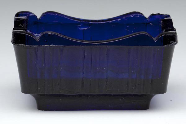 OG-23 OBLONG PRESSED SALT: OG-23 OBLONG PRESSED SALT, deep cobalt blue, sides with alternating triple-rib and column panels, double ogee rim, sunburst/rosette in base similar to Lee/Rose 324 cup plate. Rare. Possibly Boston & S