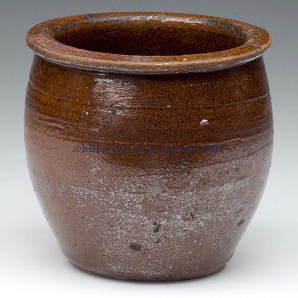 MIDDLE SHENANDOAH VALLEY OF VA EARTHENWARE DIMINUTI: MIDDLE SHENANDOAH VALLEY OF VA EARTHENWARE DIMINUTIVE CROCK, double lead glazed with iron-oxide spotting, approximately 1 pint capacity, squatty wide-mouth form with lightly incised ring below the fla