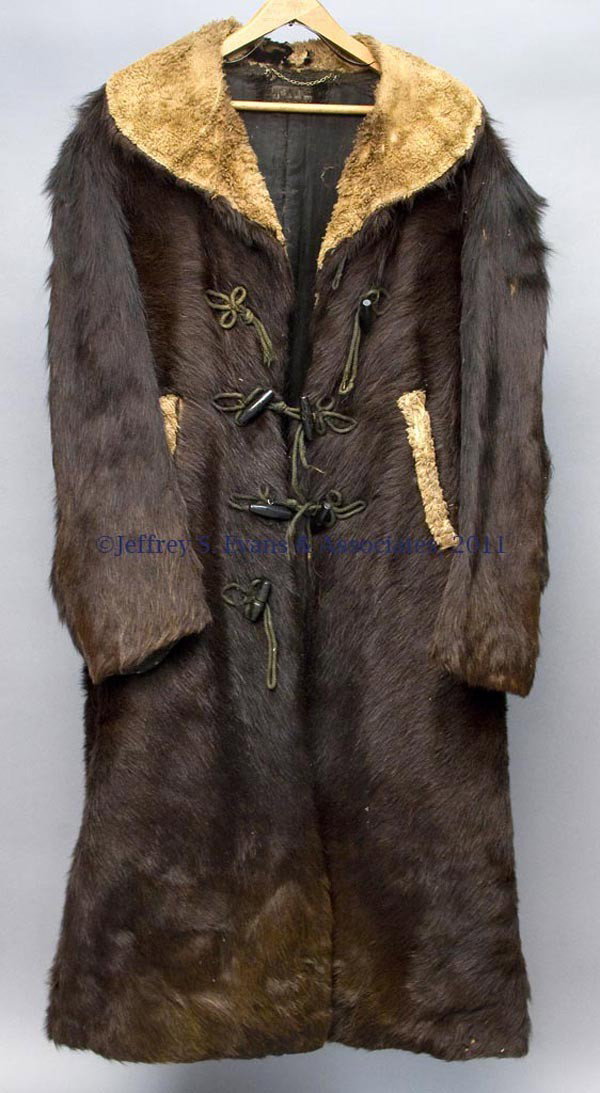 ANIMAL SKIN POLAR OUTFIT, LOT OF SIX PIECES: ANIMAL SKIN POLAR OUTFIT, LOT OF SIX PIECES, comprising a full-length bear-skin coat with military-type piping button mounts and ebonized wood buttons, a pair of bear-skin gauntlets, a pair of seal-sk