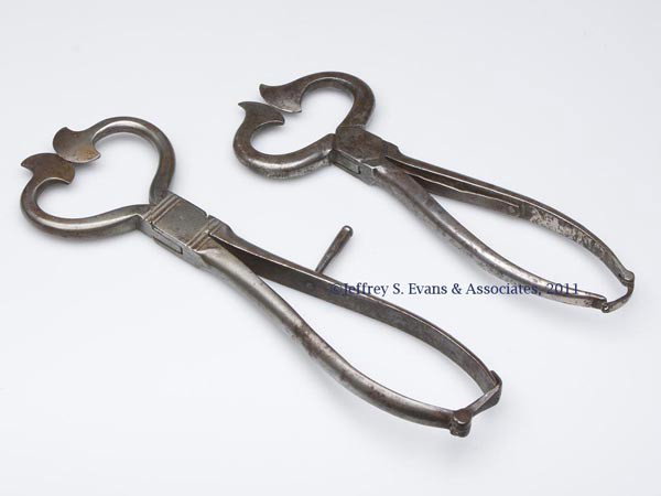 TWO STEEL SUGAR NIPPERS: TWO STEEL SUGAR NIPPERS, each complete with handle spring and latch. First half 19th century. 8 1/4" and 9 1/2" L. Provenance: Estate collection of Dorothy and Marshall Jenkins.