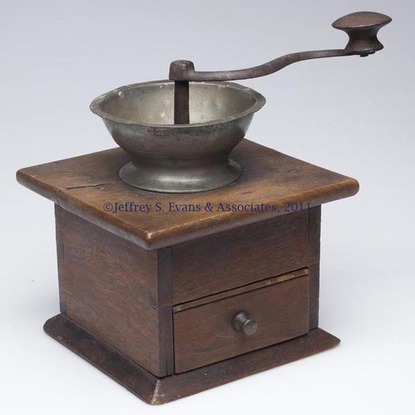 PENNSYLVANIA WALNUT COFFEE GRINDER: PENNSYLVANIA WALNUT COFFEE GRINDER, dovetailed case with single drawer and pewter hopper. Very good dry historical surface. First half 19th century. 7" H, 7" x 7". Provenance: Estate collection of Dor