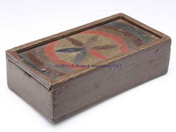MID-ATLANTIC DECORATED SLIDE-TOP WRITING BOX: MID-ATLANTIC DECORATED SLIDE-TOP WRITING BOX, constructed from cigar boxes, divided interior, original Spanish brown paint with a scribed and polychrome painted six-petal rosette on lid and diamonds u