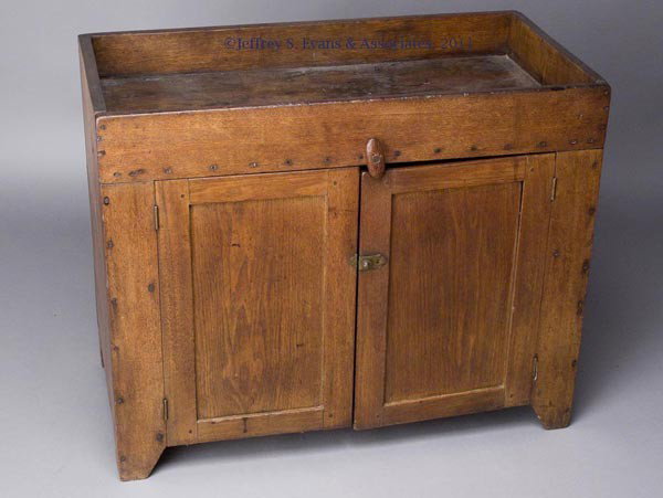 VIRGINIA WALNUT DIMINUTIVE DRY SINK: VIRGINIA WALNUT DIMINUTIVE DRY SINK, square-nailed full-length well above two fielded-panel doors, raised on simple cut-out feet. Walnut secondary wood. Good older surface. Second quarter 19th century