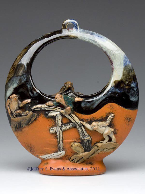 JAPANESE SUMIDA BASKET VASE: JAPANESE SUMIDA BASKET VASE, with four applied monkeys, unmarked. Late 19th to mid 20th century. 8 3/4" HOA, 2" x 7 1/2" OA. Provenance: Collection of Bertram (Bert) Cohen.