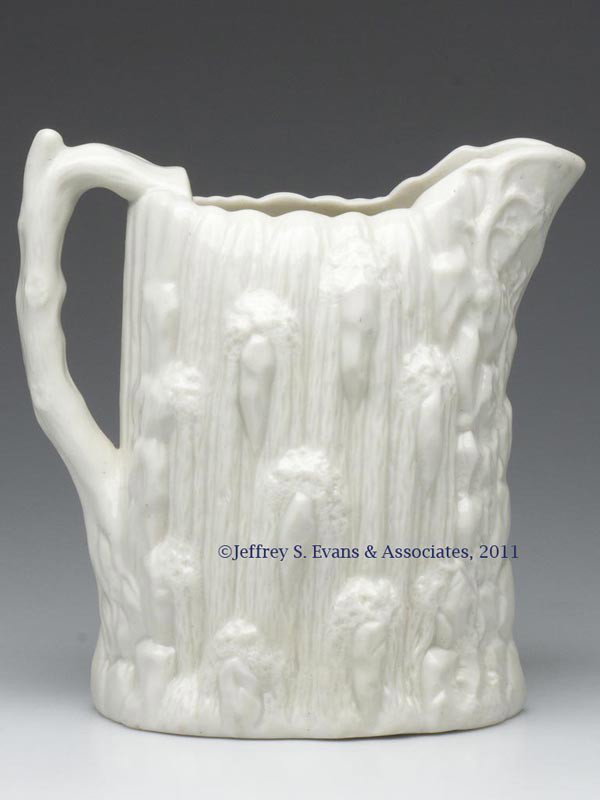BENNINGTON PORCELAIN PITCHER: BENNINGTON PORCELAIN PITCHER, white, Cascade pattern, base with embossed U. S. Pottery Co. lozenge, Mark G Lyman Fenton & Co., Bennington, VT. 1852-1858. 8 1/2" HOA, 5 3/4" x 6 1/4" OA. Literature: Pa