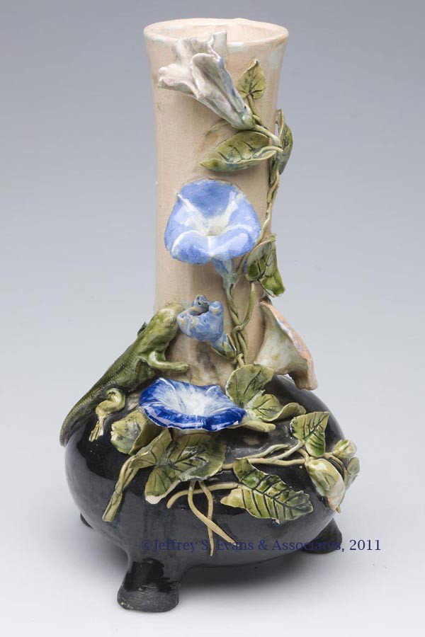 UNIDENTIFIED MAJOLICA VASE: UNIDENTIFIED MAJOLICA VASE, polychrome decoration, with applied salamander and morning glories, raised on three feet. Late 19th/early 20th century. 10 1/4" HOA, 5 1/2" DOA. Provenance: Collection of A