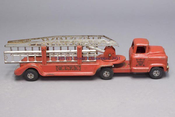 BUDDY "L" PRESSED STEEL NO. 6 TOY LADDER FIRE TRUCK: BUDDY "L" PRESSED STEEL NO. 6 TOY LADDER FIRE TRUCK original red paint with decals on each door and "B. L. F. D." decal to each side of trailer, grill with "550", fitted with a hydraulic ladder and tw