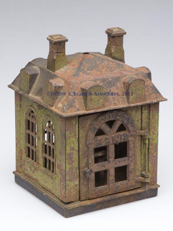 "NOVELTY BANK" CAST-IRON MECHANICAL BANK: "NOVELTY BANK" CAST-IRON MECHANICAL BANK door opens and rotates teller, original trap closure. J. & E. Stevens Co. Fourth quarter 19th century. 6 1/2" H.