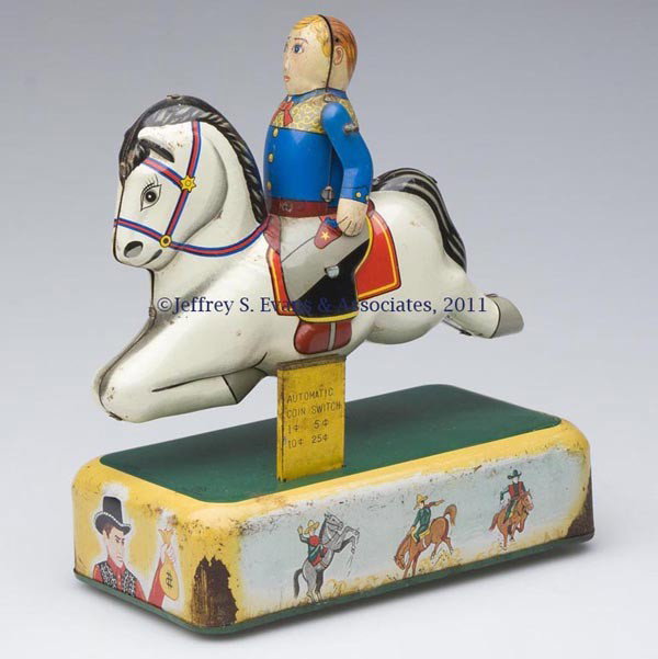 CRAGSTAN RIDING HORSE BATTERY-OPERATED TIN TOY: CRAGSTAN RIDING HORSE BATTERY-OPERATED TIN TOY coin activated, rider with articulated arms. Mid 20th century. 7 1/2" H, 6 1/2" x 3 3/4" base. Provenance: Estate collection of Dorothy and Marshall Jenk